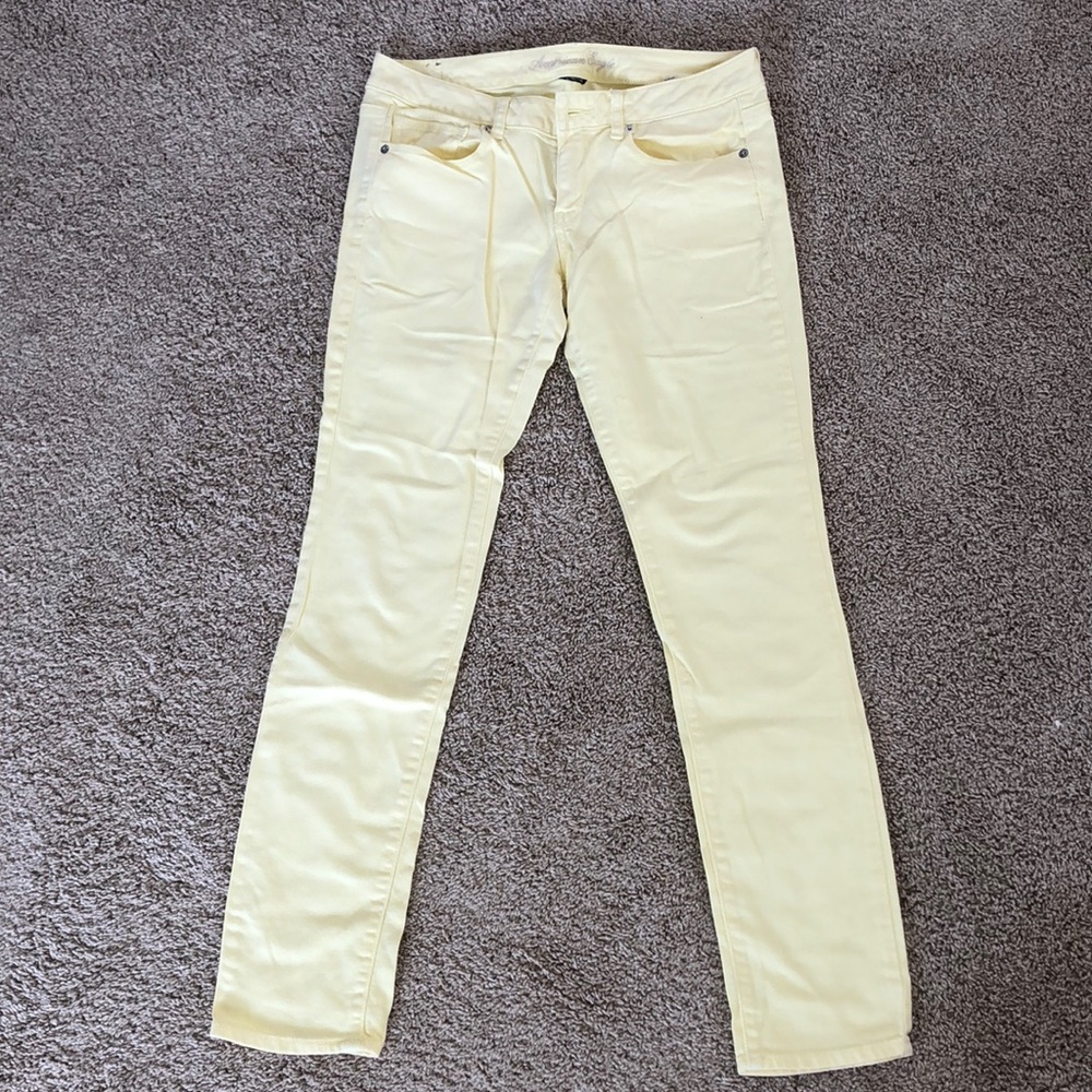Pale yellow skinny jeans